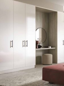Lancaster White Gloss sliding wardrobe solutions, hinged wardrobe doors, and bespoke interior storage systems. Upsell Custom Furniture
