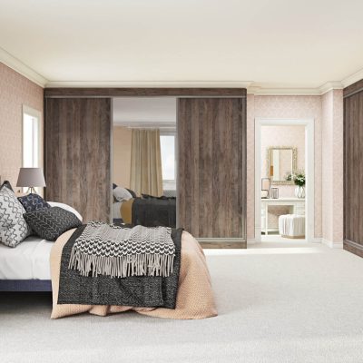 Dual sliding wardrobe doors with aluminium frames and wood effect panels in an elegant bedroom