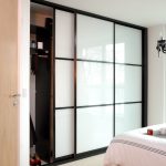 sliding wardrobe doors in small compact room