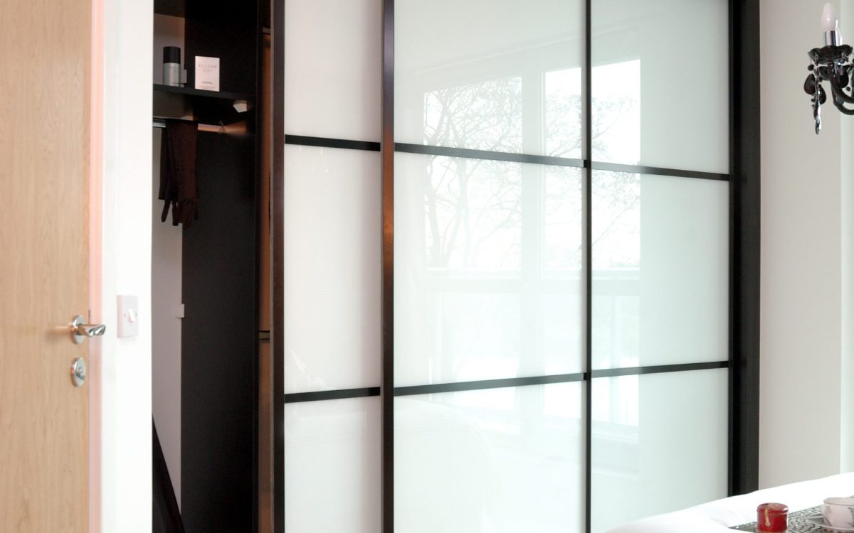 sliding wardrobe doors in small compact room