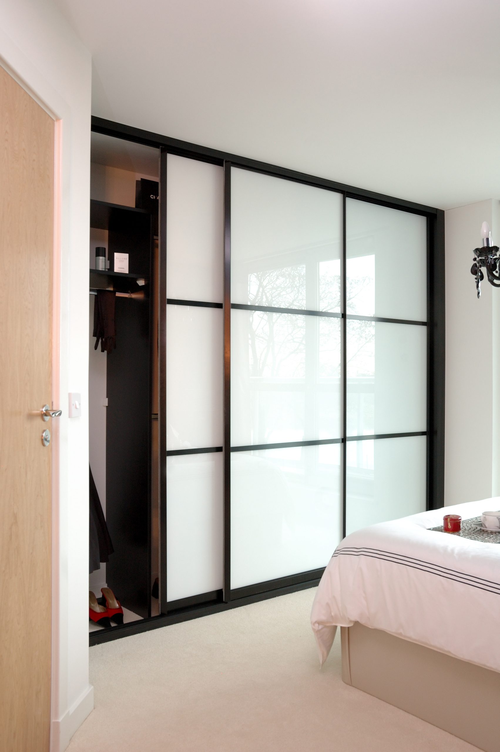 sliding wardrobe doors in small compact room